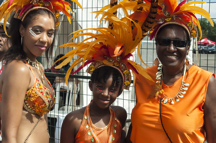 This is the first year Brittany, Tanejaé and June (l to r) are playing mas together along with over a dozen friends and family. Taking the lead of the Seasons of Change band, the ladies were seen grooving in a fiery flock of orange, red, and bronze throughout the Autumn Dance section. For Tanejaé the parade is very important, as it is a time to celebrate her culture and enjoy time with family and friends.